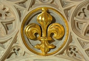 A gold-painted fleur de lis emblem from Westminster Abbey