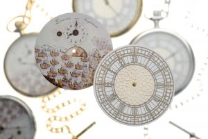 Bespoke pocket watch dials by Mallards with pocket watches in the background