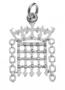 A sterling silver charm in the shape of a crowned portcullis.