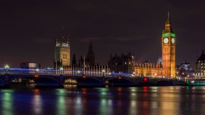 A view of Westminster at night, taken from across the Thames.