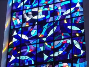 Fish design on stained glass window