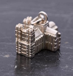A small silver pendant in the shape of Westminster Abbey
