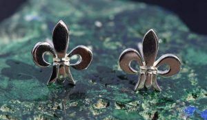 A pair of sterling silver fleur de lis earrings