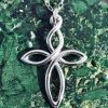 A sterling silver twist cross pendant on a chain