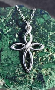 A sterling silver twist cross pendant on a chain