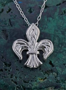 A silver fleur de lis pendant