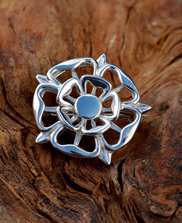 A silver Tudor Rose brooch.