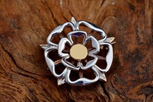 A silver and bronze Tudor Rose brooch