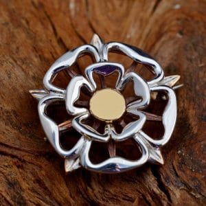 A silver and bronze Tudor Rose brooch