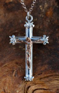 Silver crucifix for Westminster Abbey depicting the bronze figure of Christ on a Latin cross.