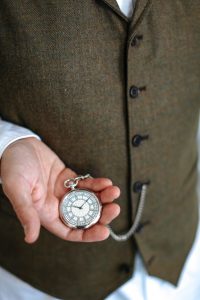 The House of Commons dial chrome pocket watch by Mallards, being worn in a waistcoat pocket