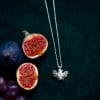 Silver bee pendant and chain with a fig