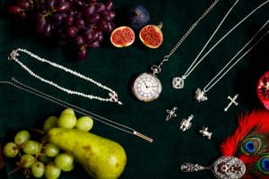 Silver jewellery with fruit and feathers